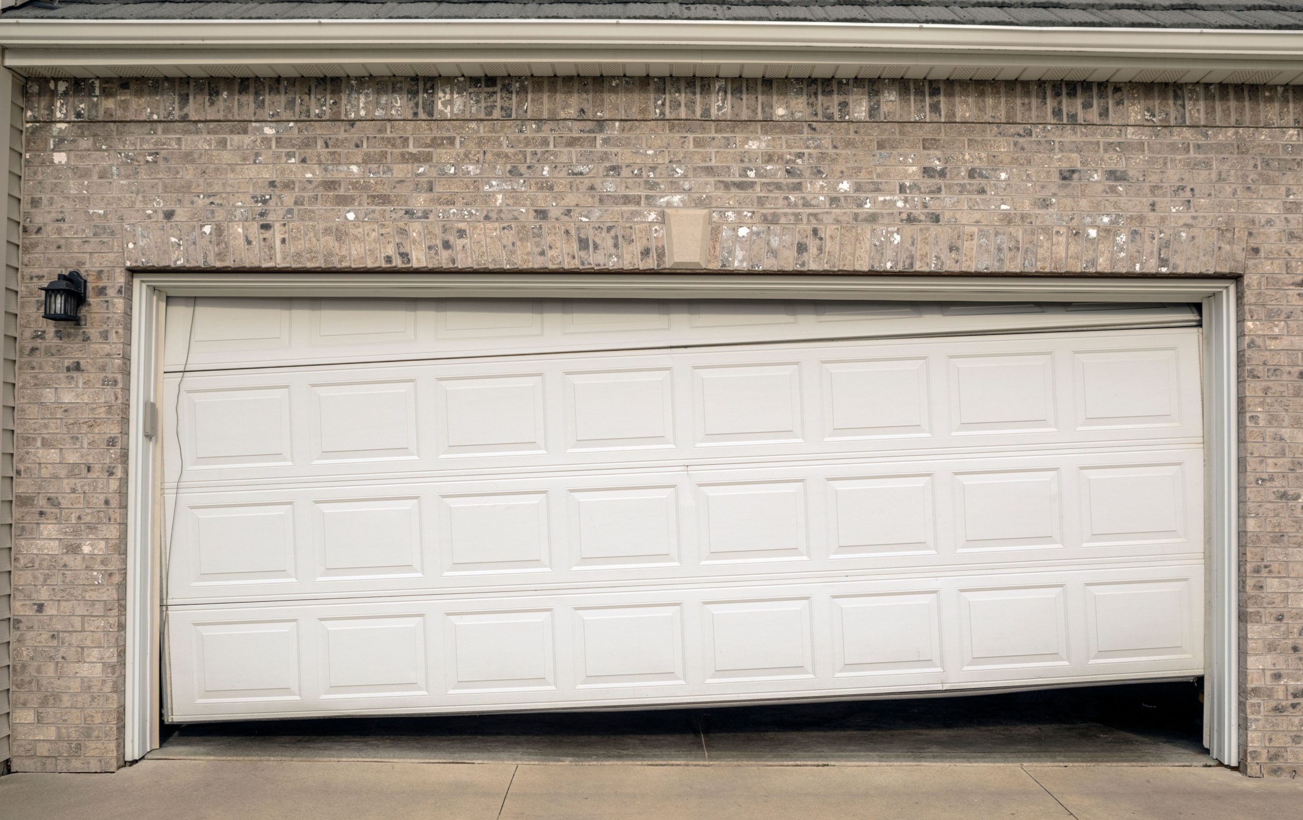 Off-track garage door needing repair in Rhode Island