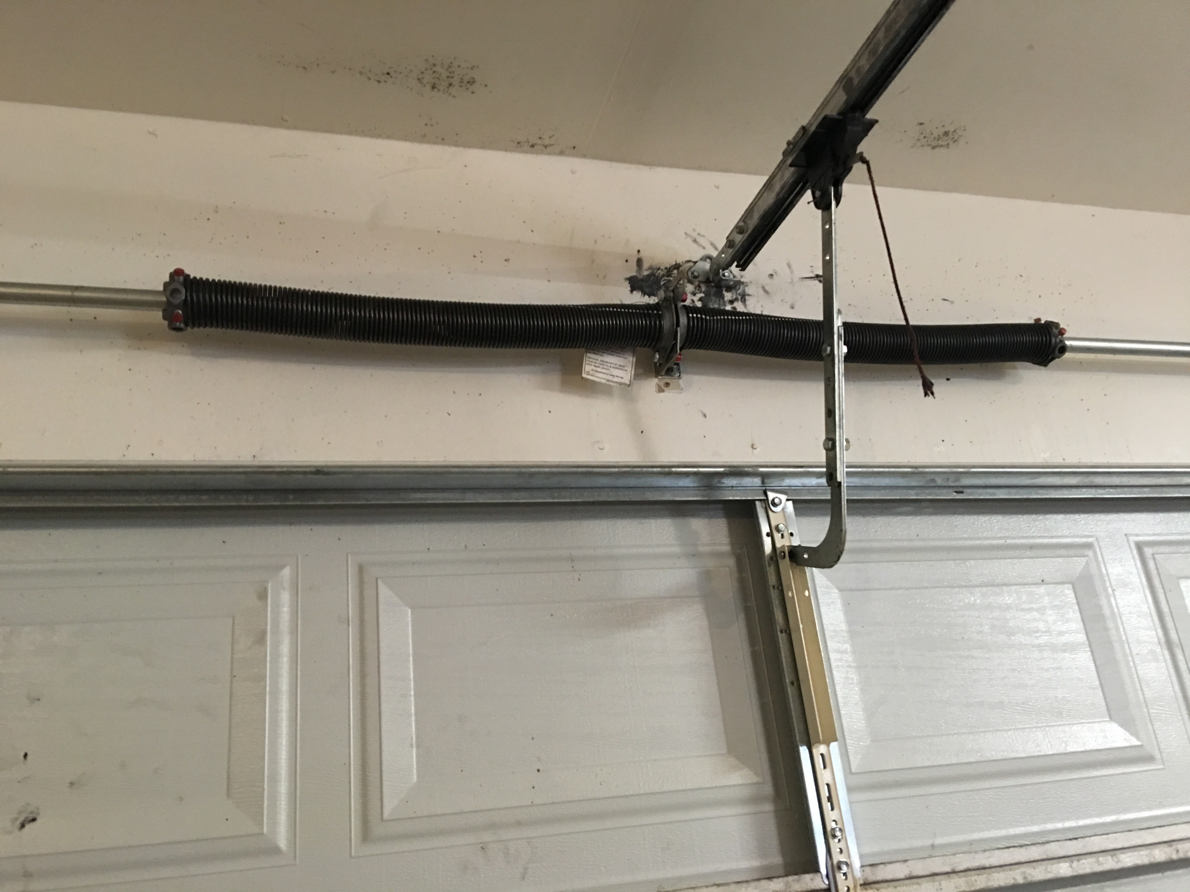 Garage door spring system conversion by Apex Garage Door Service
